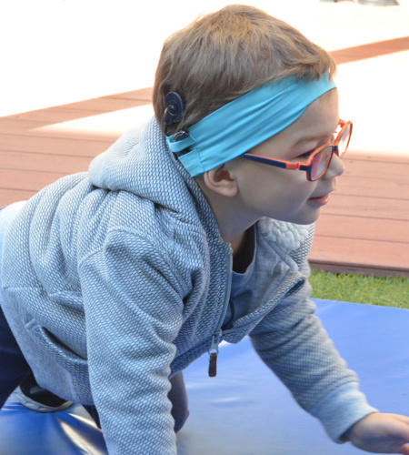 Boy With Cochlear Implant Crawling