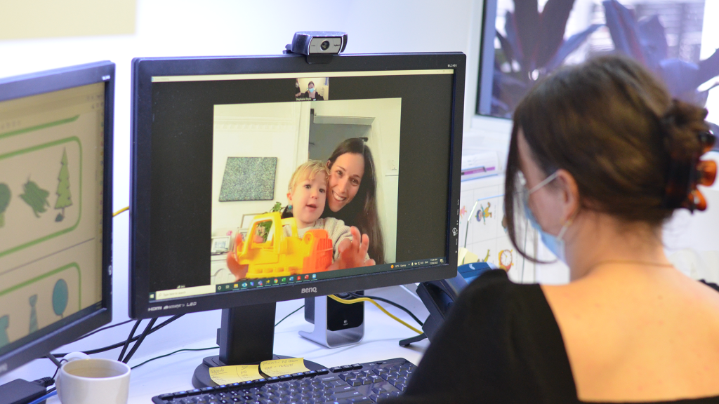 Online speech therapy session with a young child and their mum.