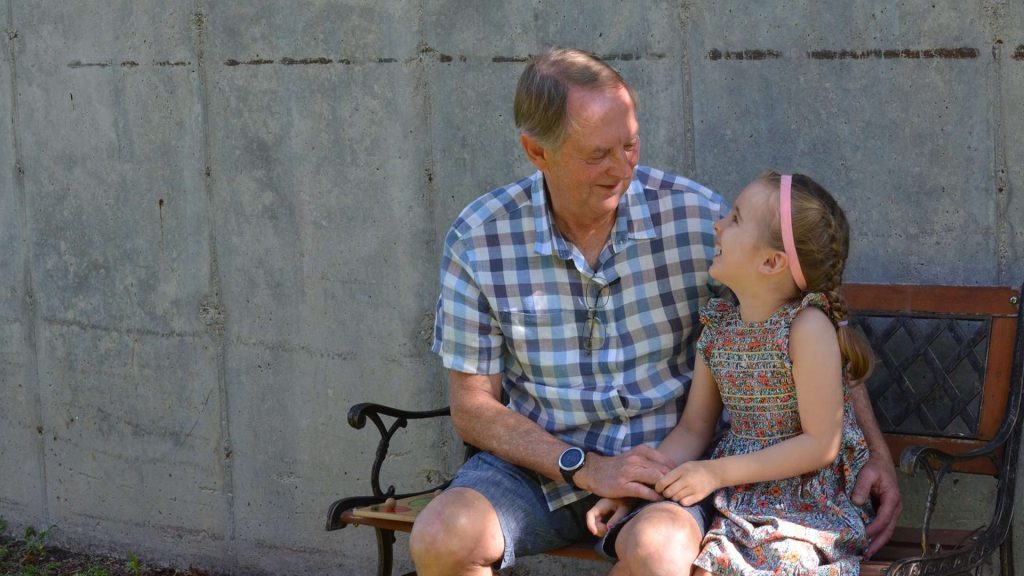 Man And Girl Laughing Looking At Each Other