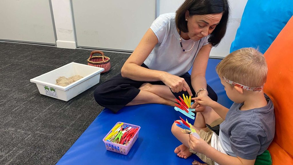Child in appointment with occupational therapist.